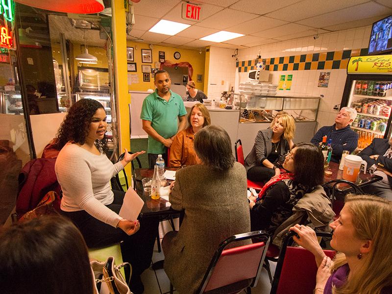 a group listens to discussion at Las Palmas restaurant
