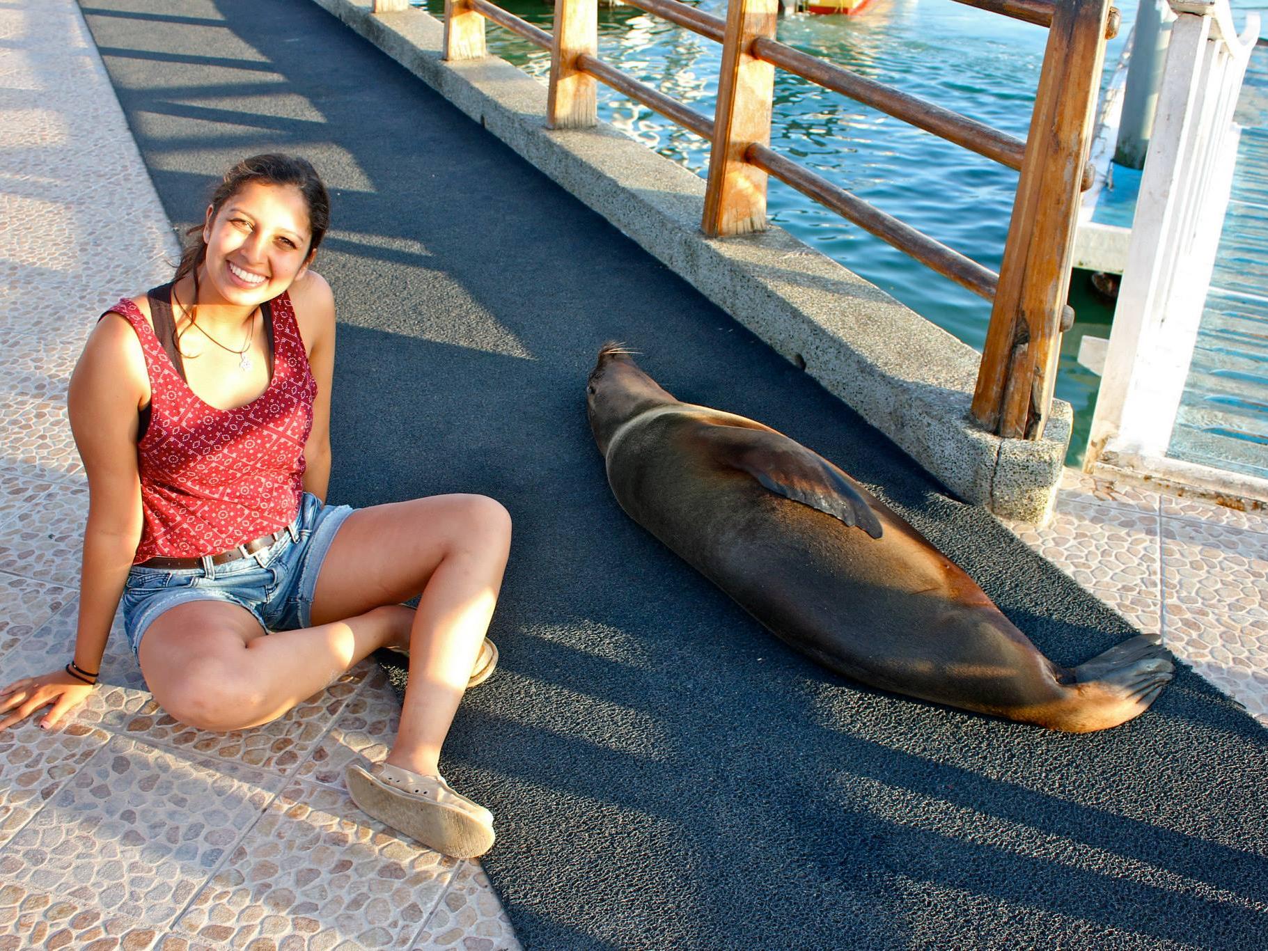 student poses next to seal