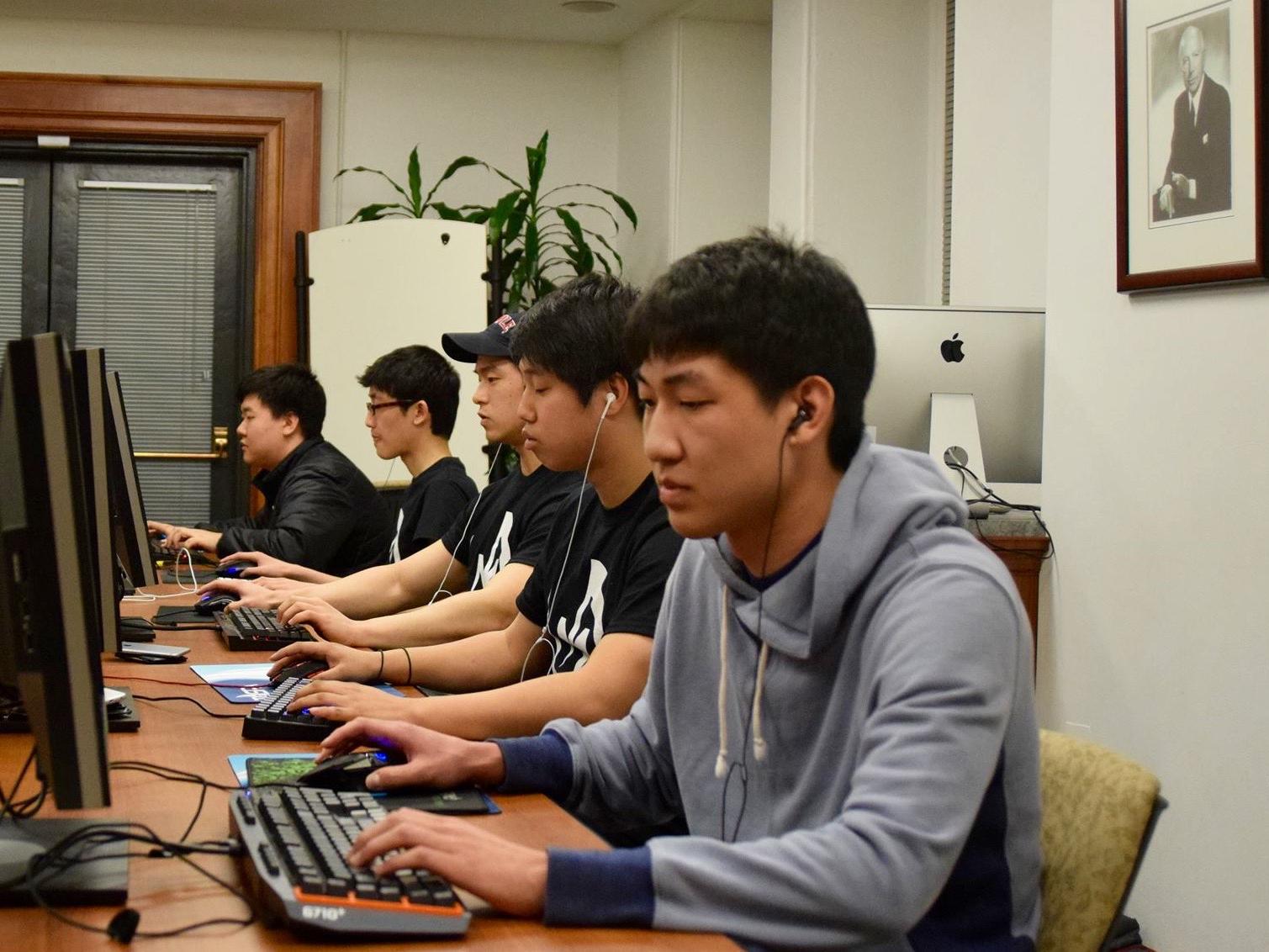 A team of five students competes in a computer lab in Carnegie Building. 