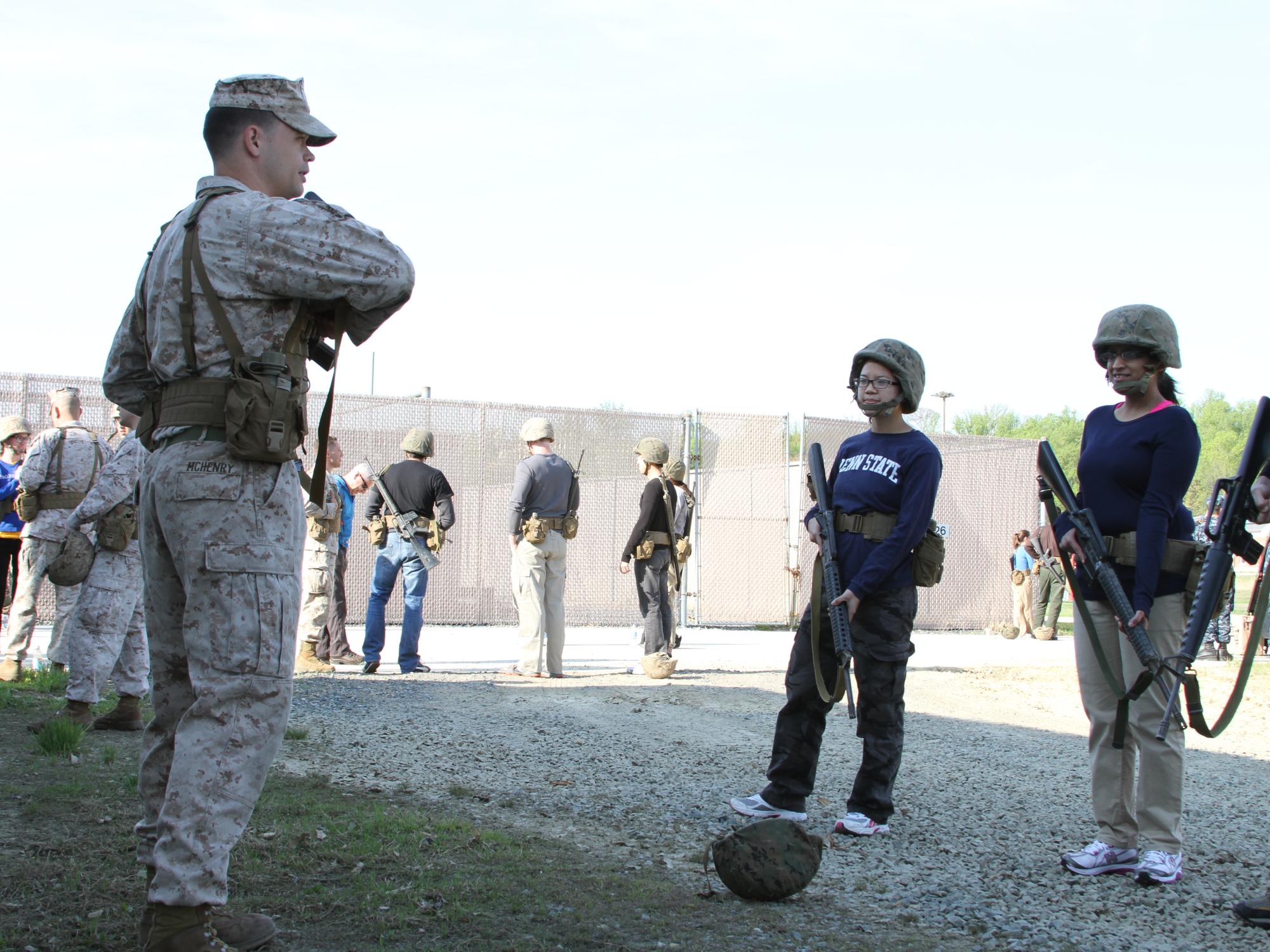 Penn State Smeal MBA students prepare for their first physical task of the day with their Marine mentors