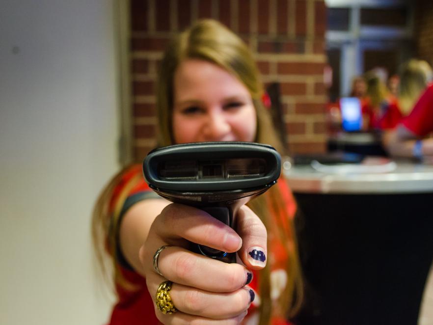 Student holding a scanner 