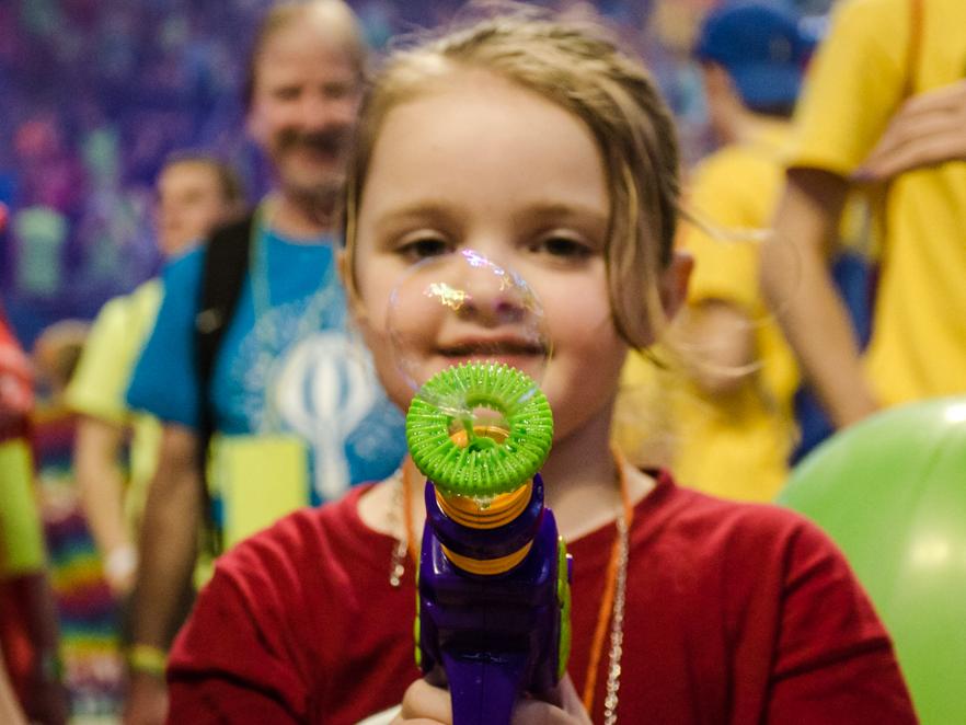 Child blowing a bubble 