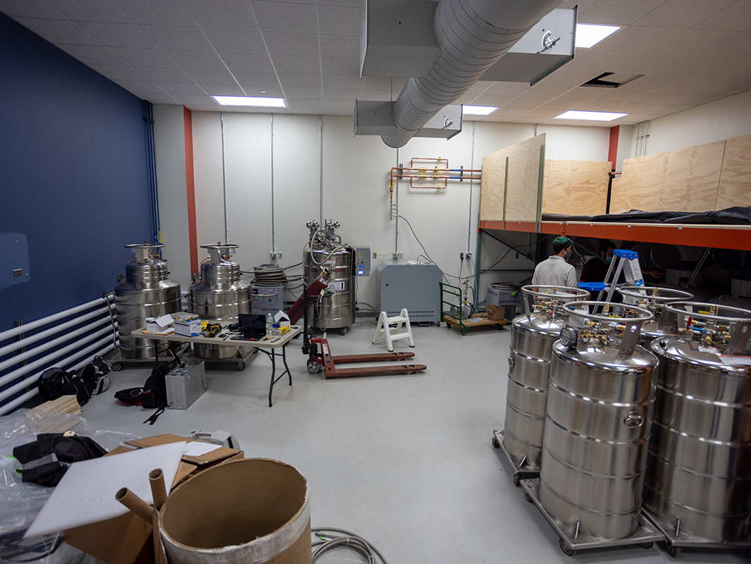 Cryomech technicians work on the Chemistry Building's helium recovery system installation.