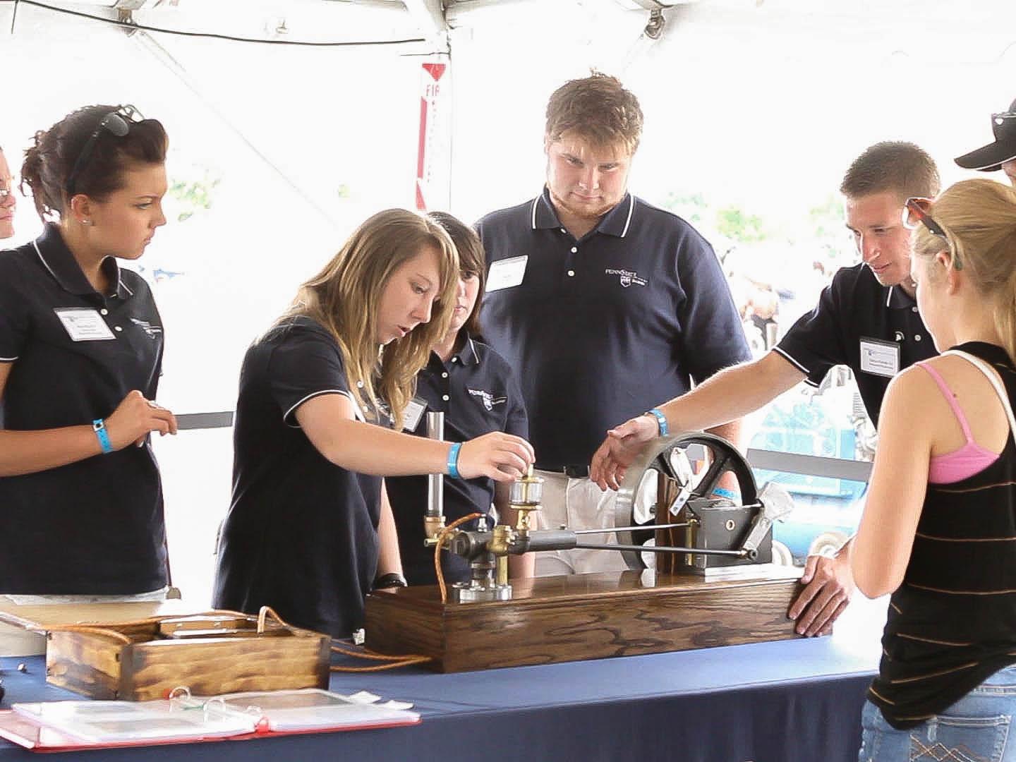 Penn State Beaver students operate Kitchen Sink Engine at Maker Faire Detroit