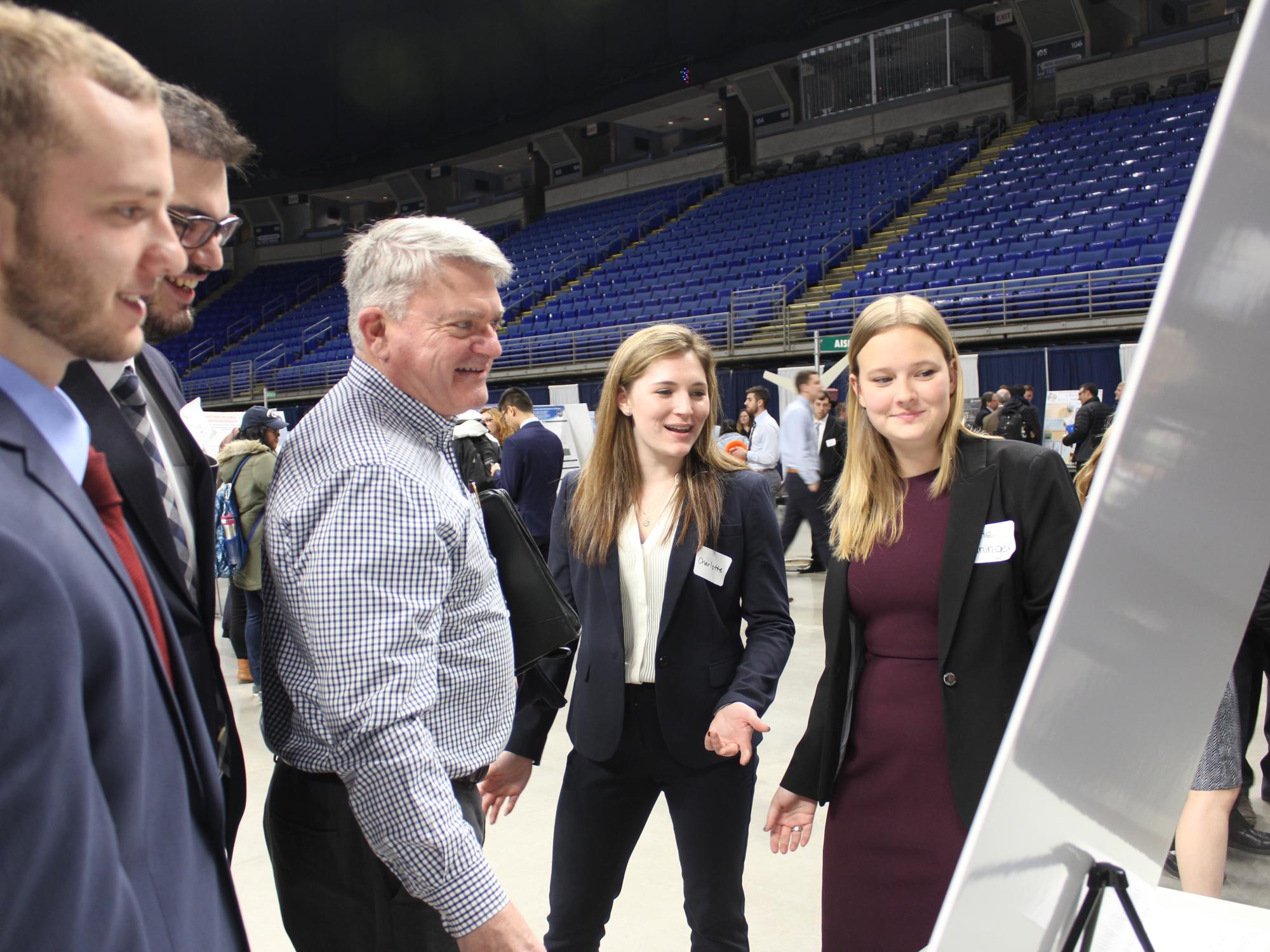 The group of industrial engineering students that worked on the fall 2017 project for ENCS, including John Haugen (far left) and Katie Heininger (far right), along with their adviser, Charlie Purdum.