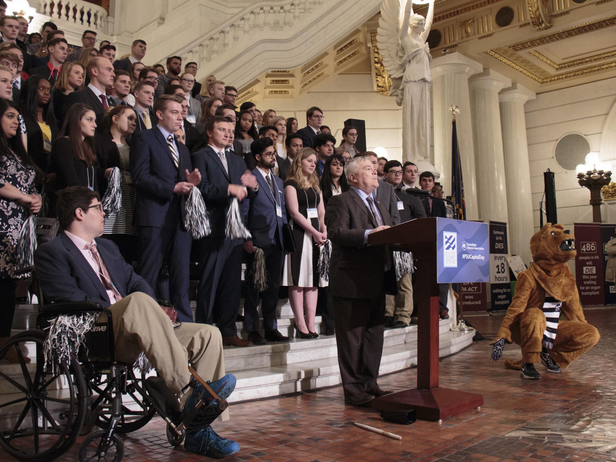 President Barron in front of rotunda steps with podium