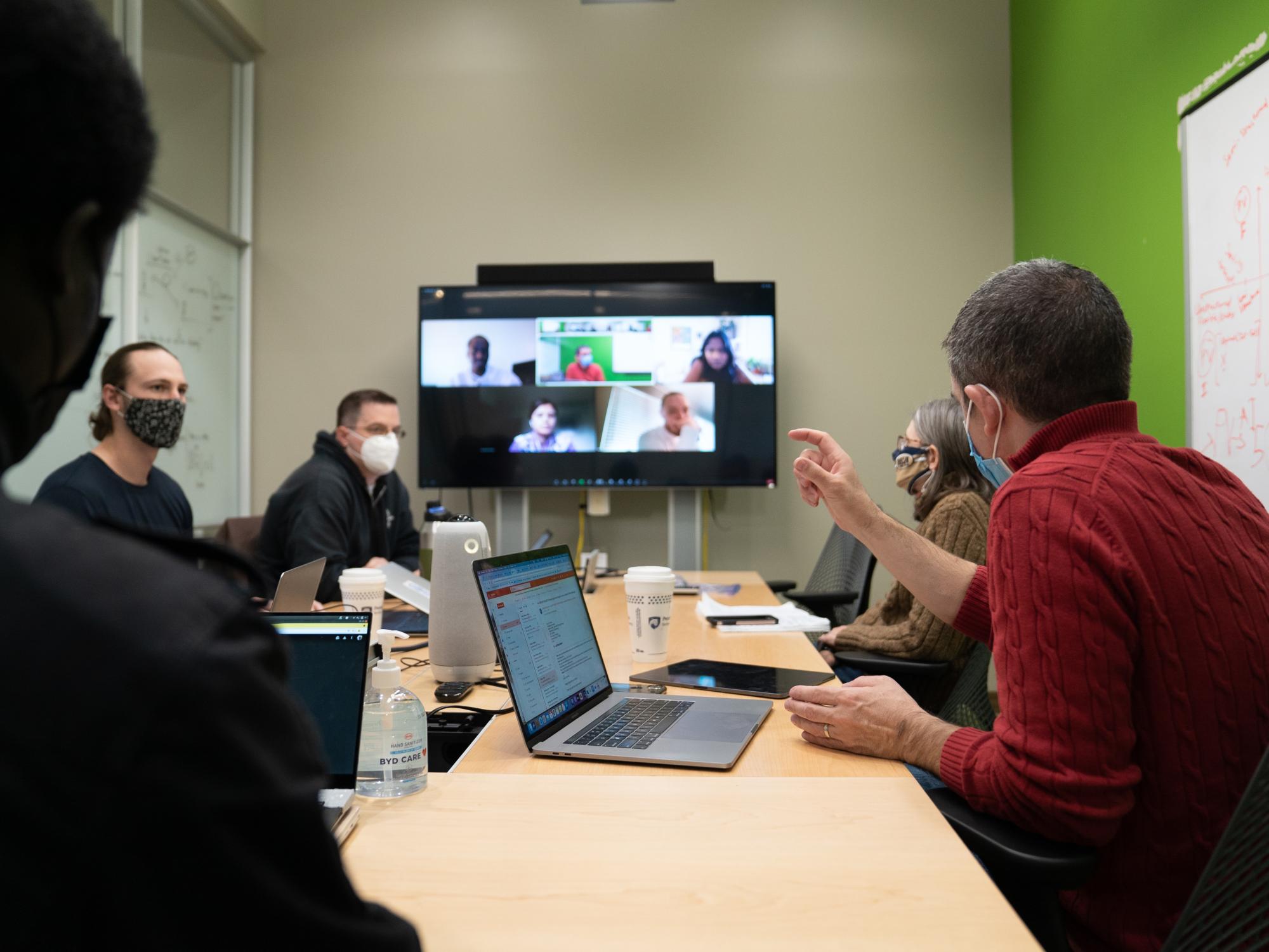 PlantVillage team videoconferencing with colleague in Africa