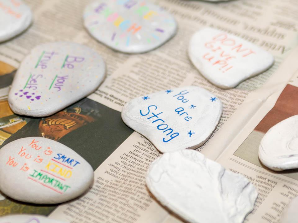 Rocks with various affirmations painted on. 