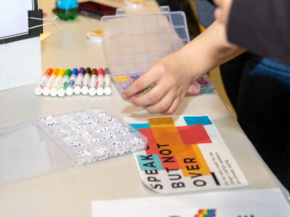 bins of beads that students are using to make bracelets 