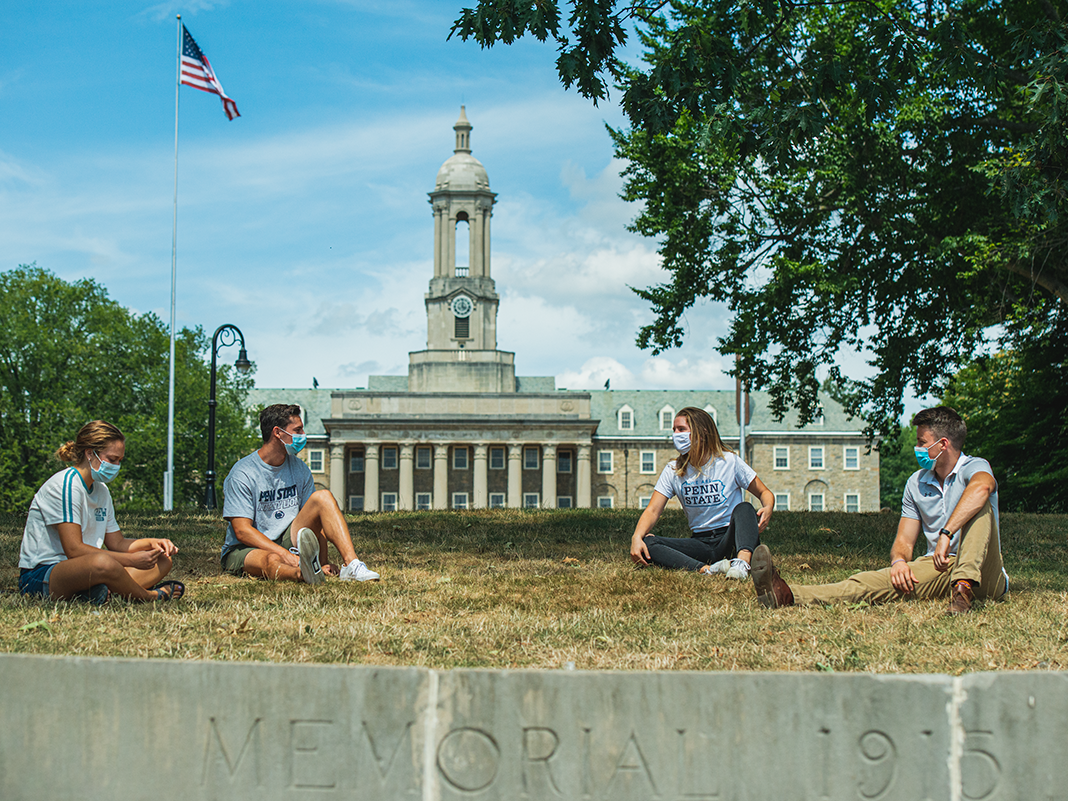 Students enjoy a beautiful day on the Old Main lawn.