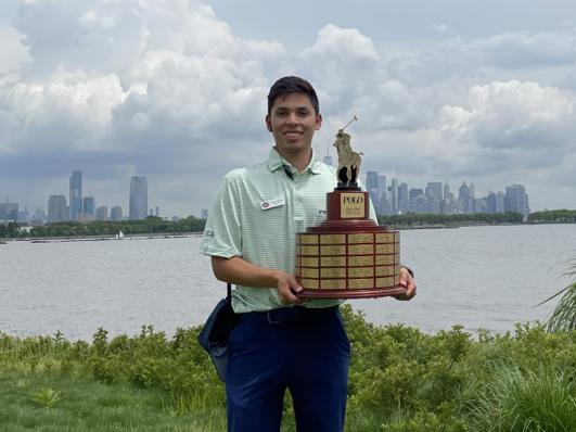 Oscar Cartegena holding trophy