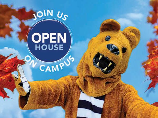 Nittany Lion with arms outstretched surrounded by fall foliage.