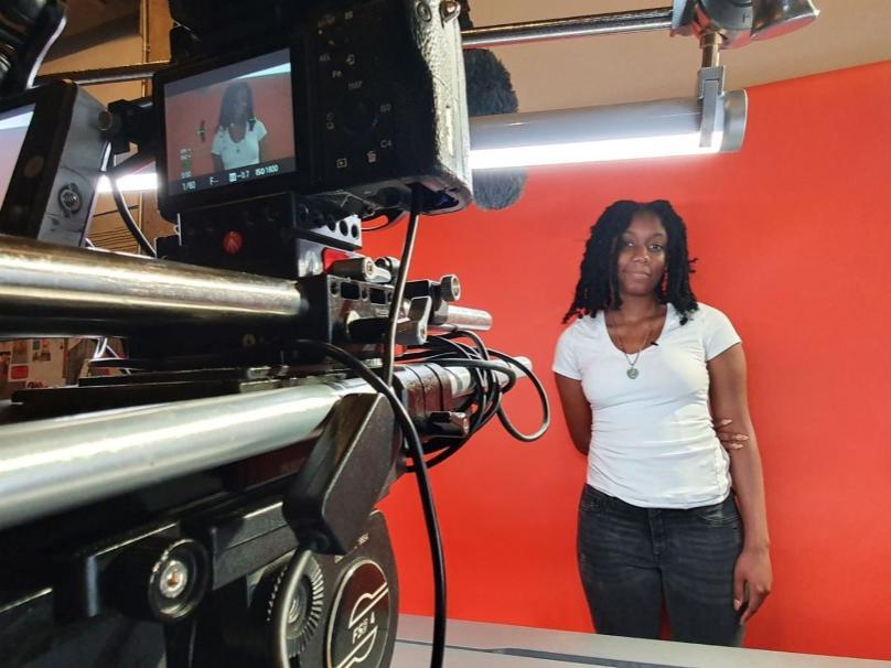 Woman being interviewed in television studio