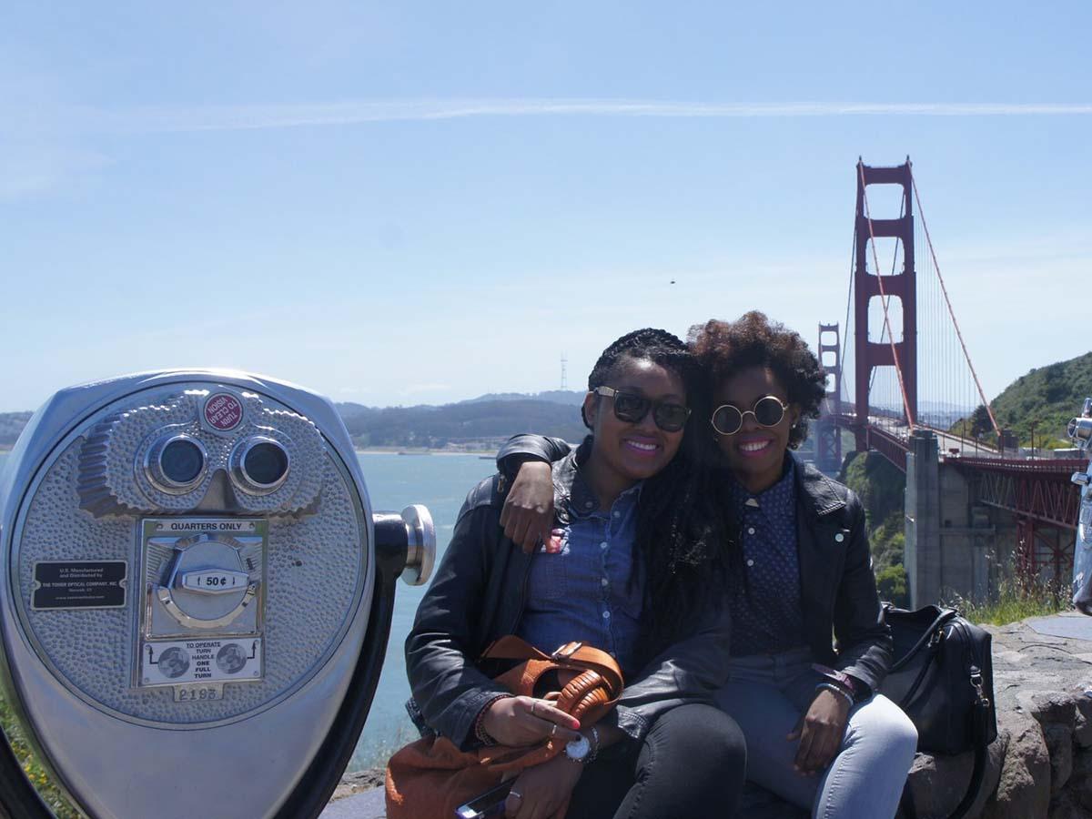 Two women at a scenic overlook near the Golden Gate Bridge in California