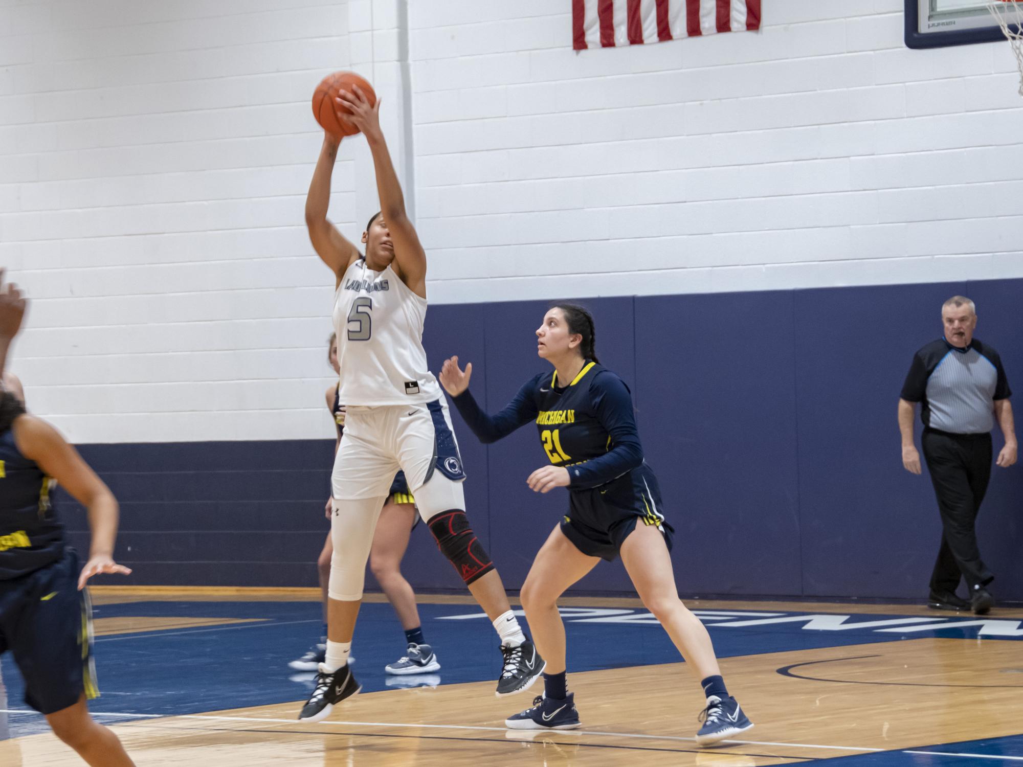 A Schuylkill women's  basketball player grabs a rebound.