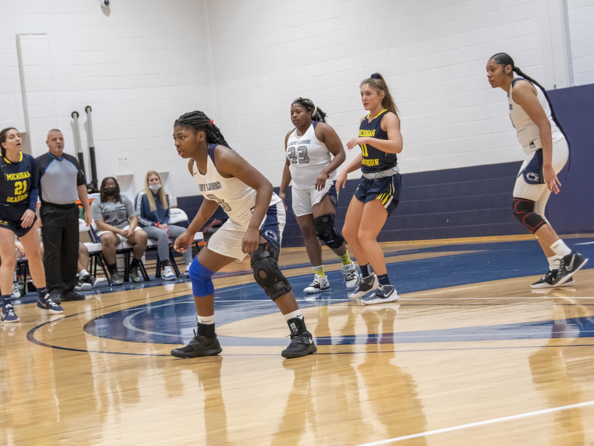 Three Schuylkill women's basketball players on the court.