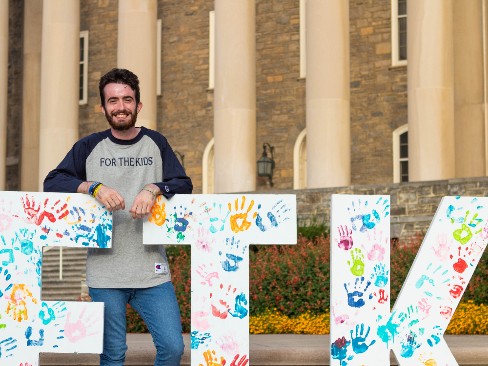 Caleb Klemick in front of Old Main
