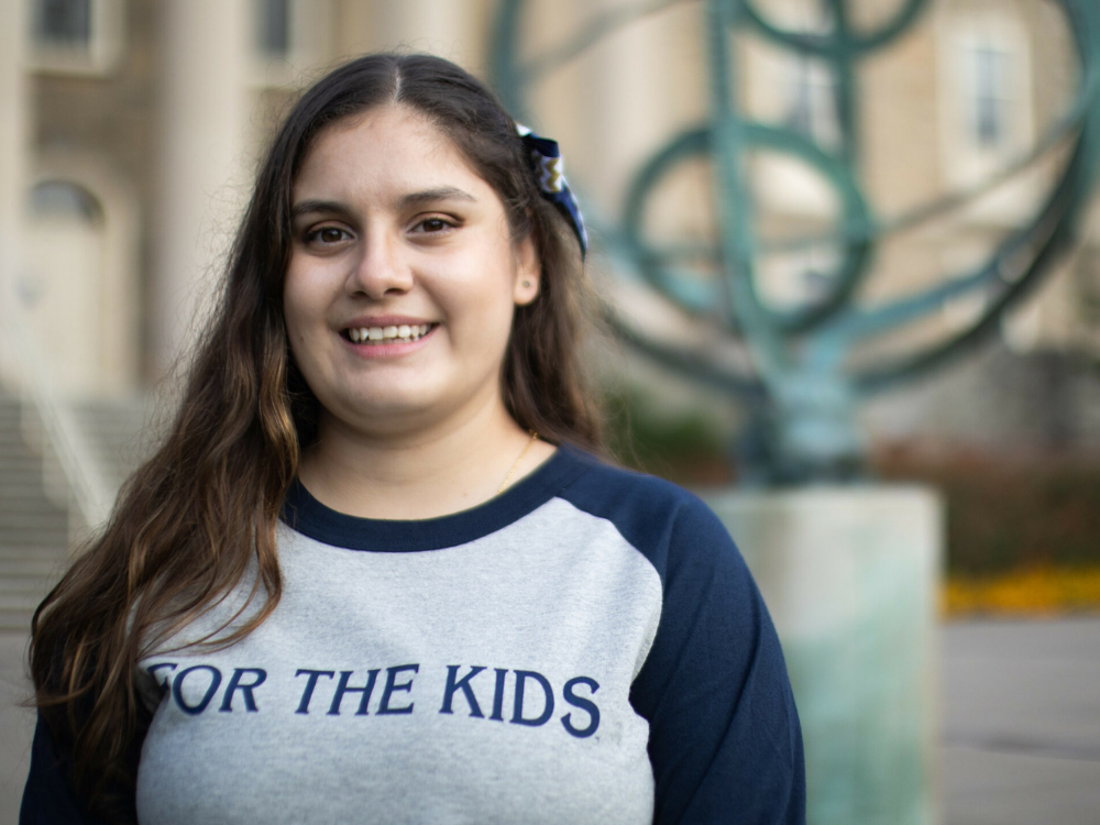 Carol Melo in front of Old Main
