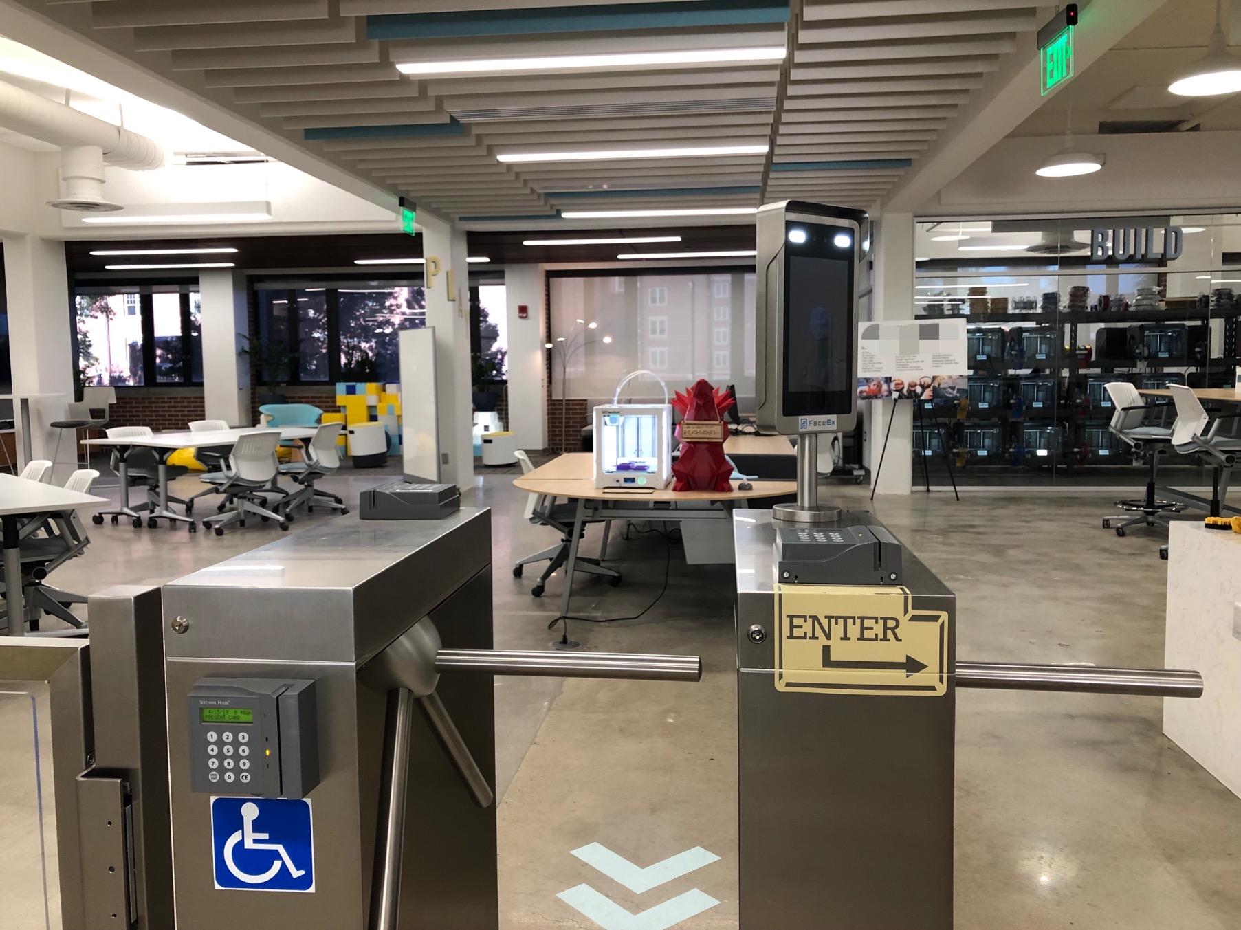 The entry point to a common space at a public U.S. university, which requires individuals to use facial recognition technology to access the space. 