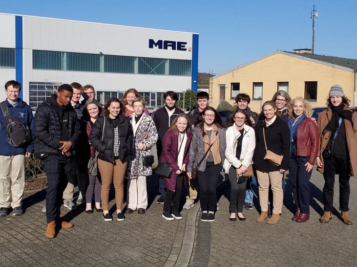 Image of Schuylkill business students in front of MAE Group, the German manufacturer they visited.