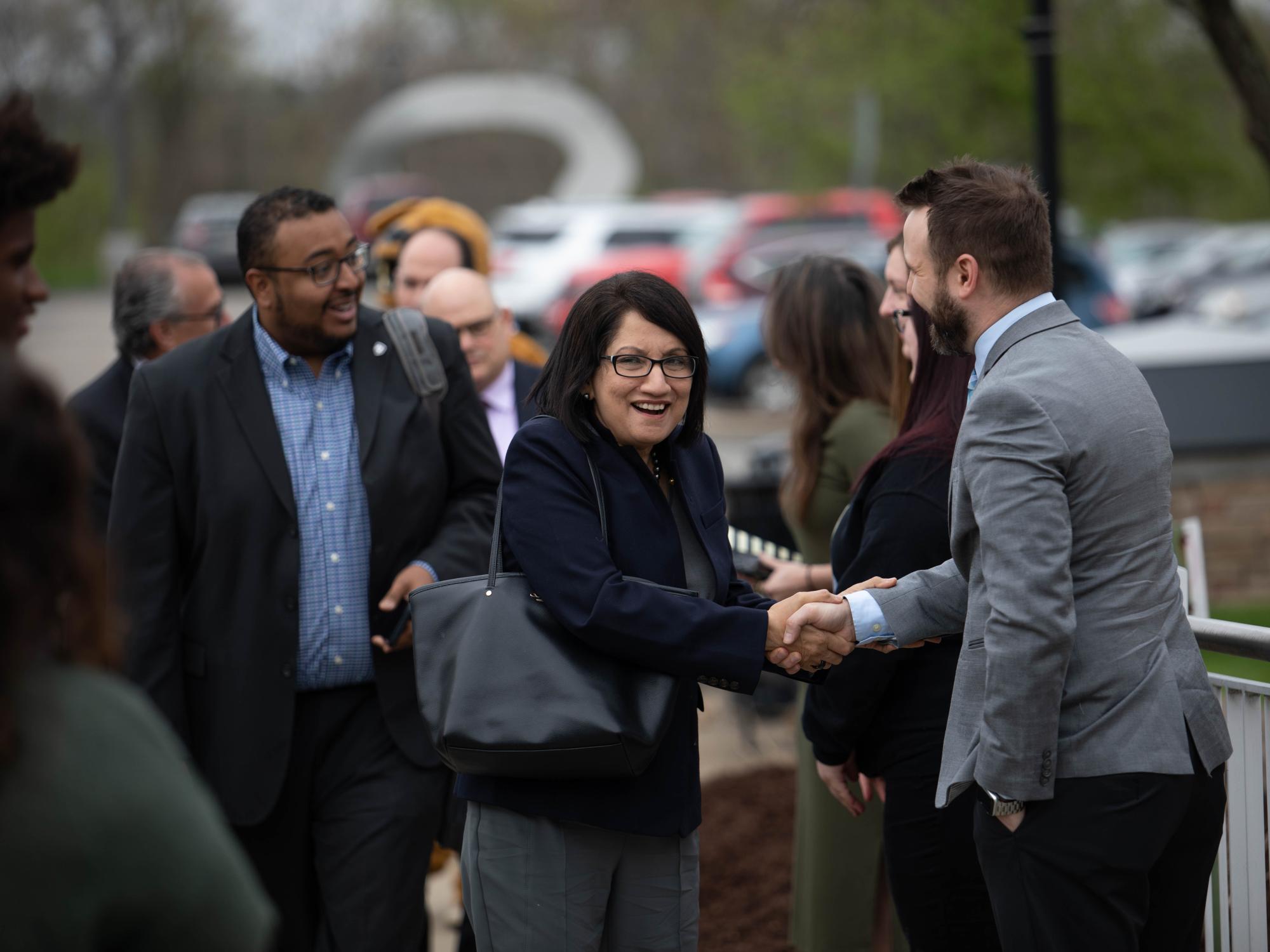 President-elect Neeli Bendapudi shakes hands