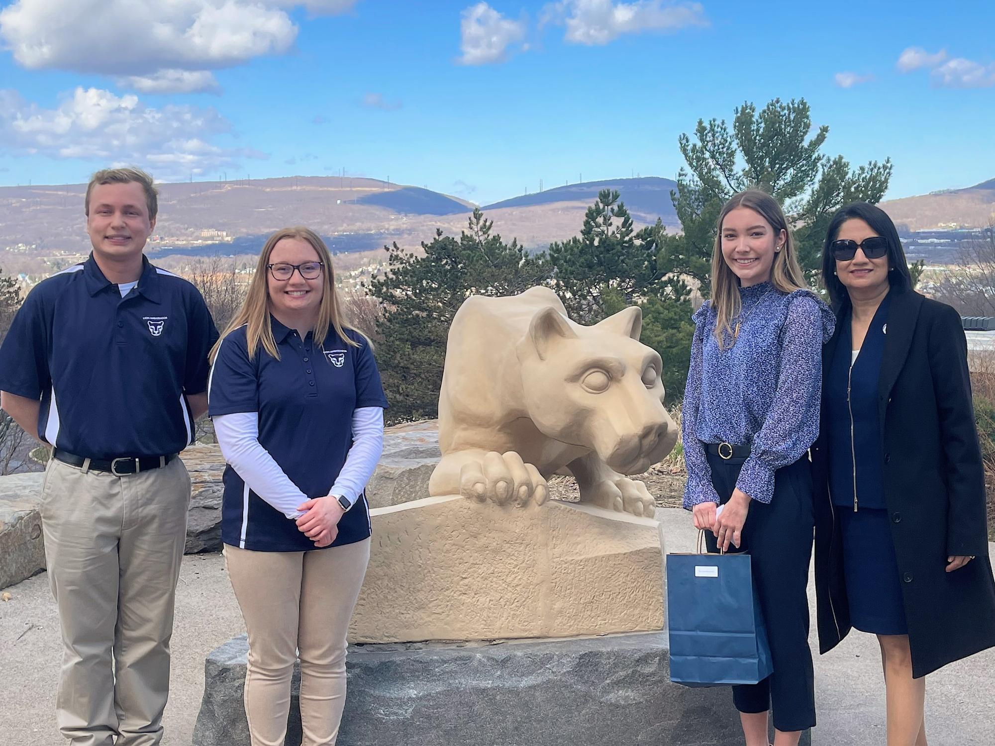 students pose with president-elect bendapudi at scranton lion shrine
