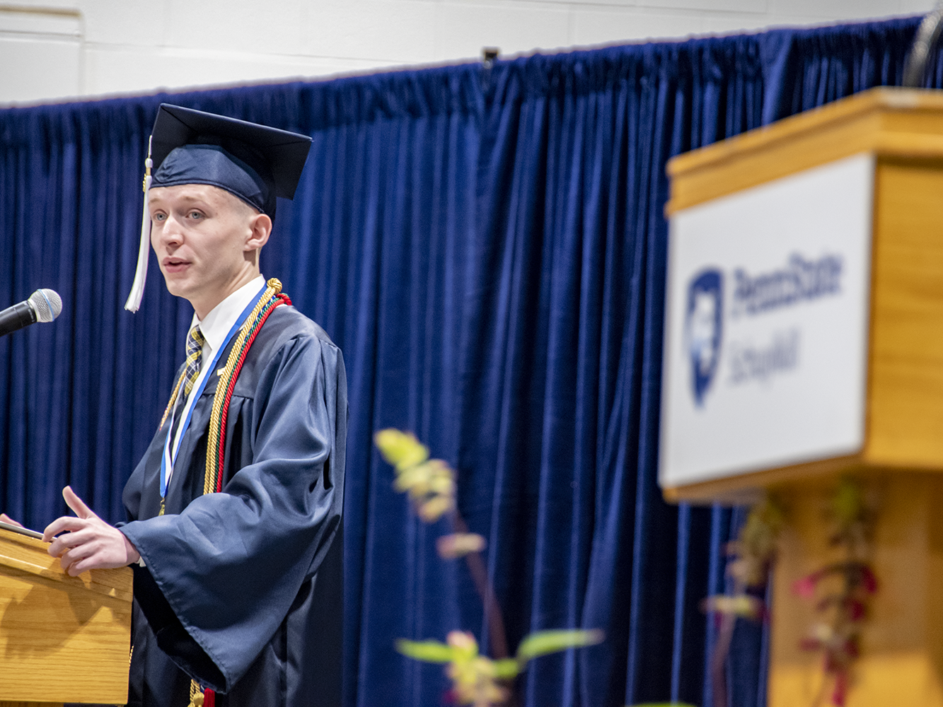 Student speaker at podium.