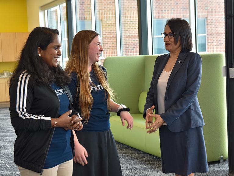 Two Lion Ambassadors speaking to Bendapudi