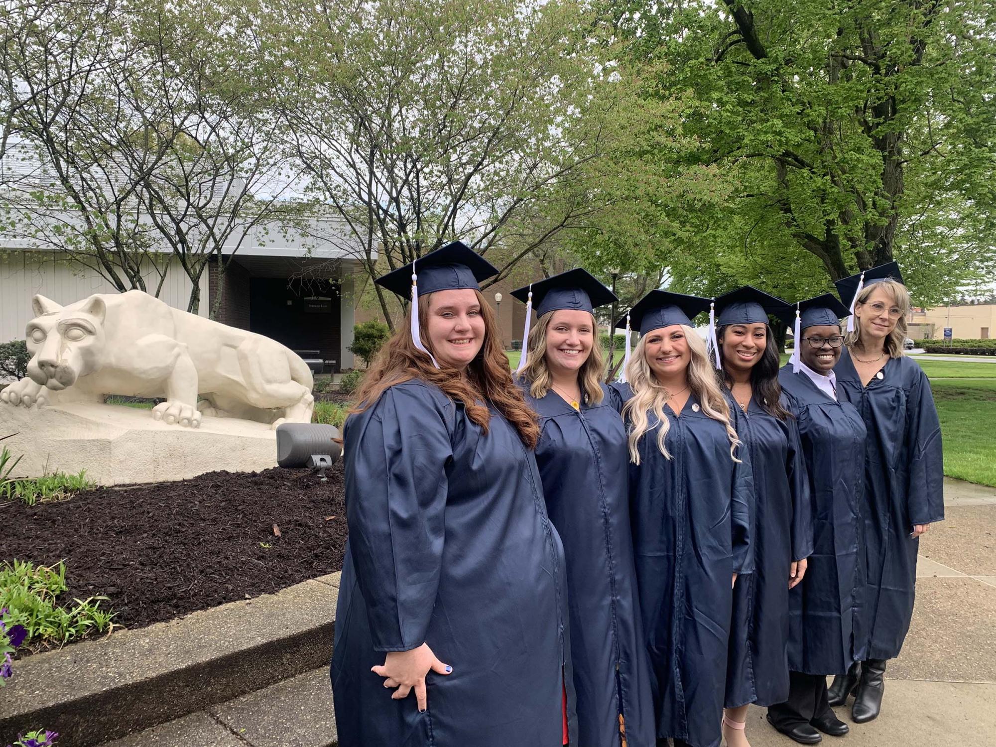 Six Shenango nursing students next to Nittany Lion Shrine