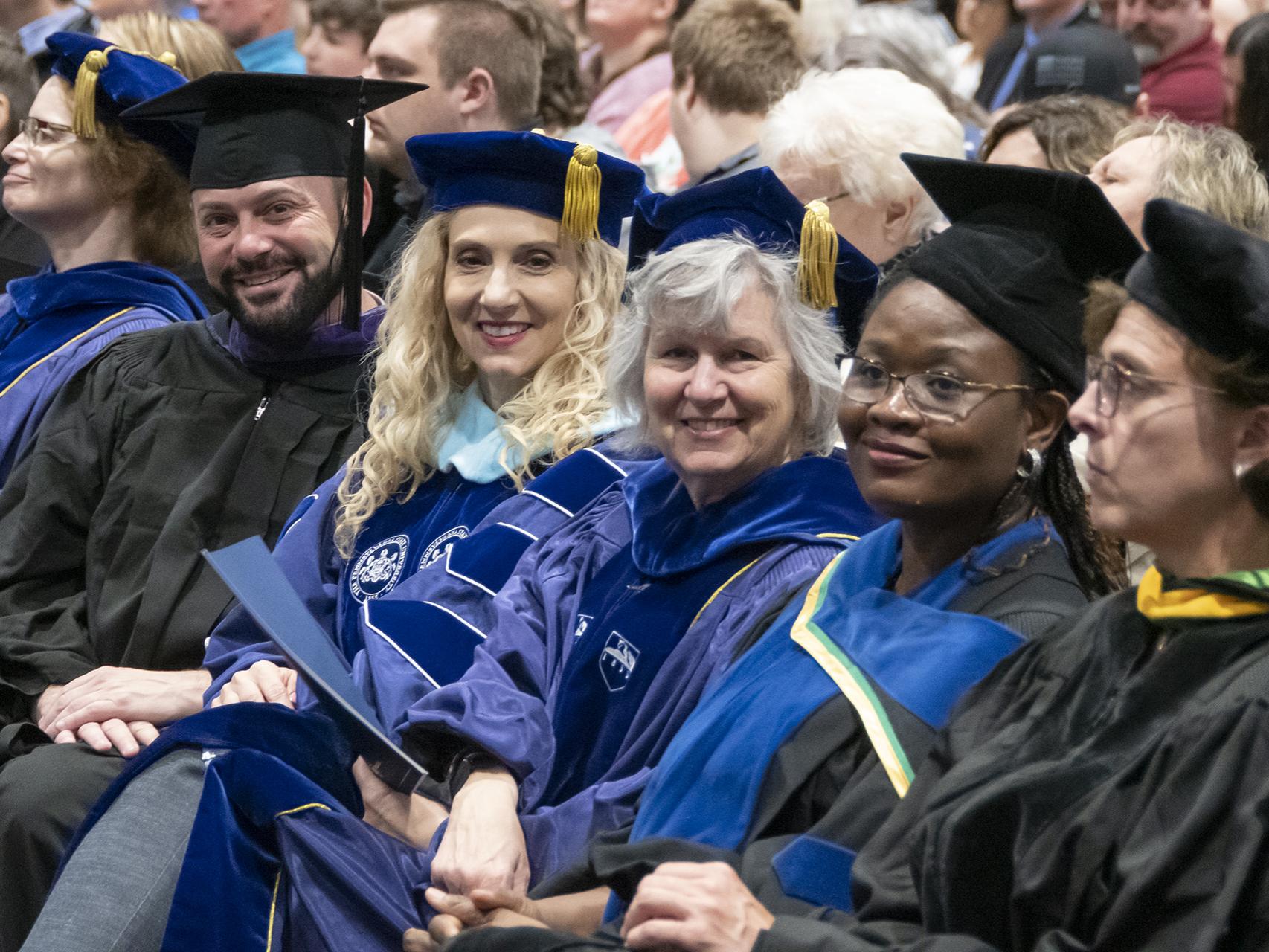 Faculty members in academic regalia.