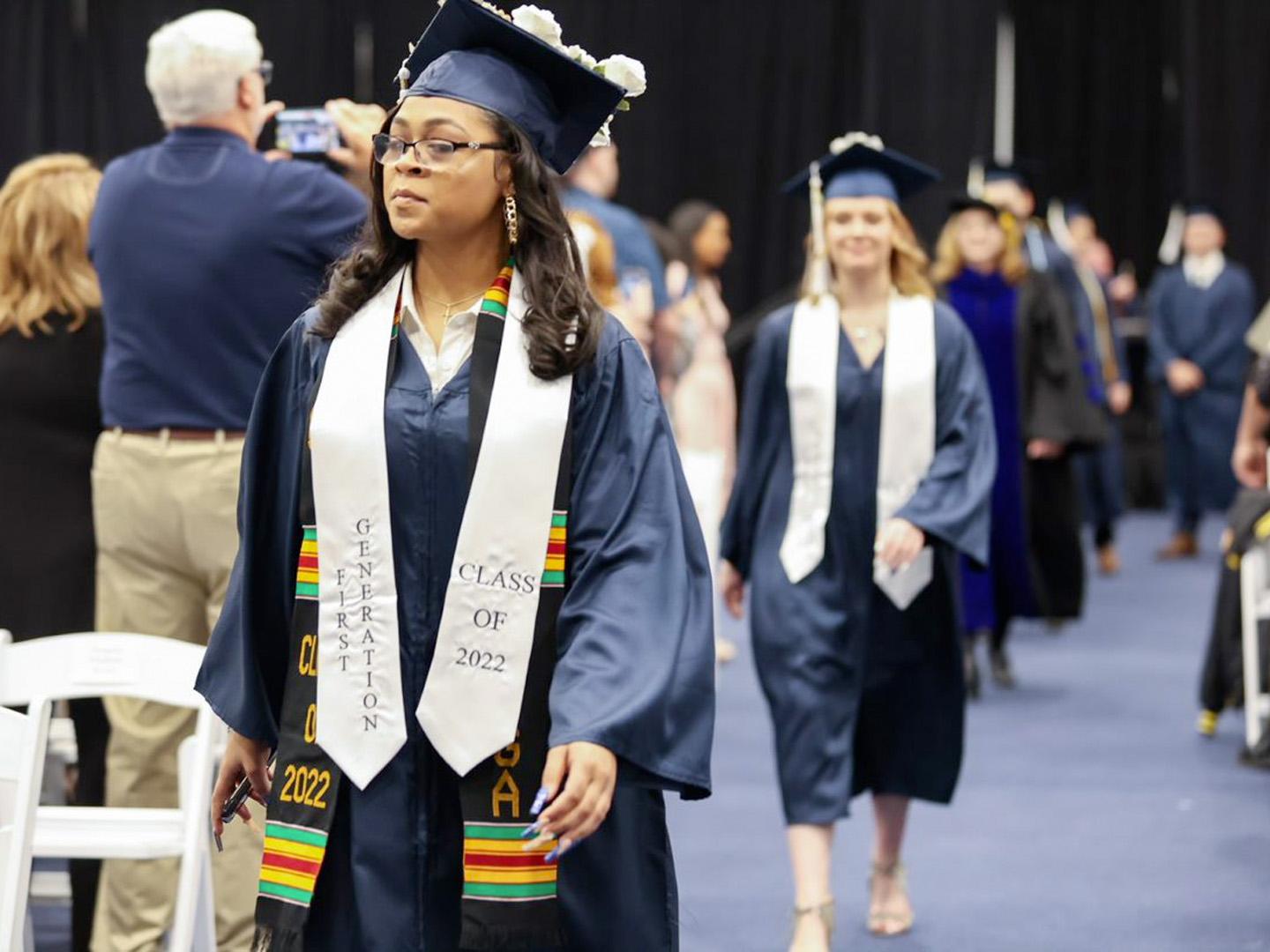 Graduate walking down the aisle 