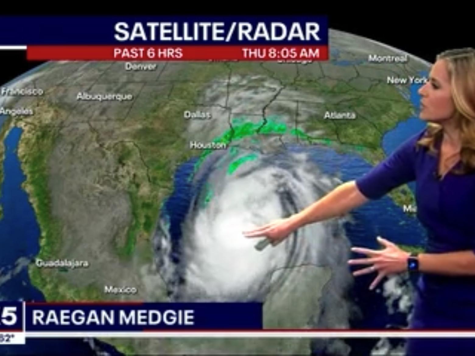 Raegan Medgie stands in front of a weather map during a TV broadcast.