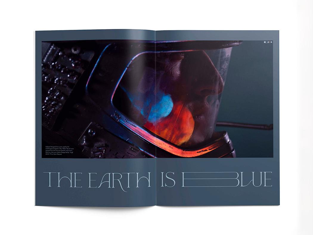 A magazine spread of a man's face in a space suit with the words The Earth is Blue. 