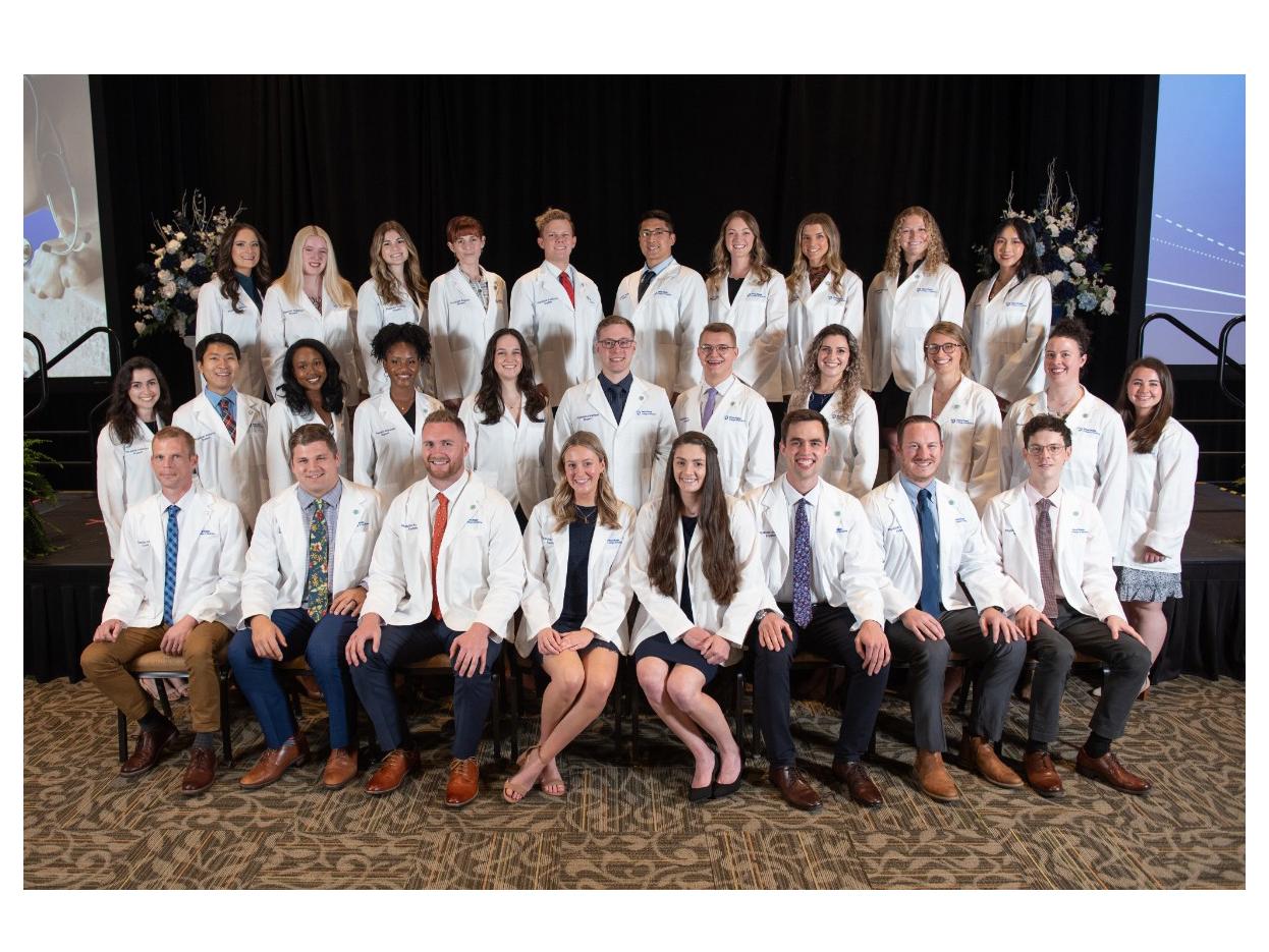 Twenty-nine members of the physician assistant entering class of 2022 pose for a group picture following the White Coat Ceremony.