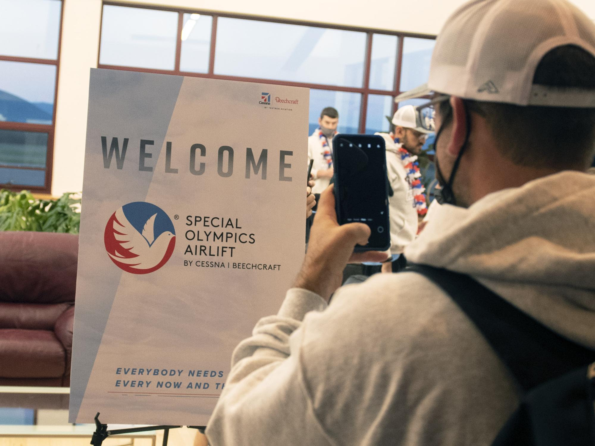 sign at terminal welcoming athletes