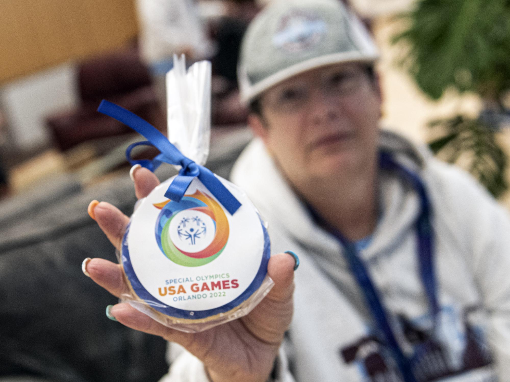 Special Olympian with souvenir cookie