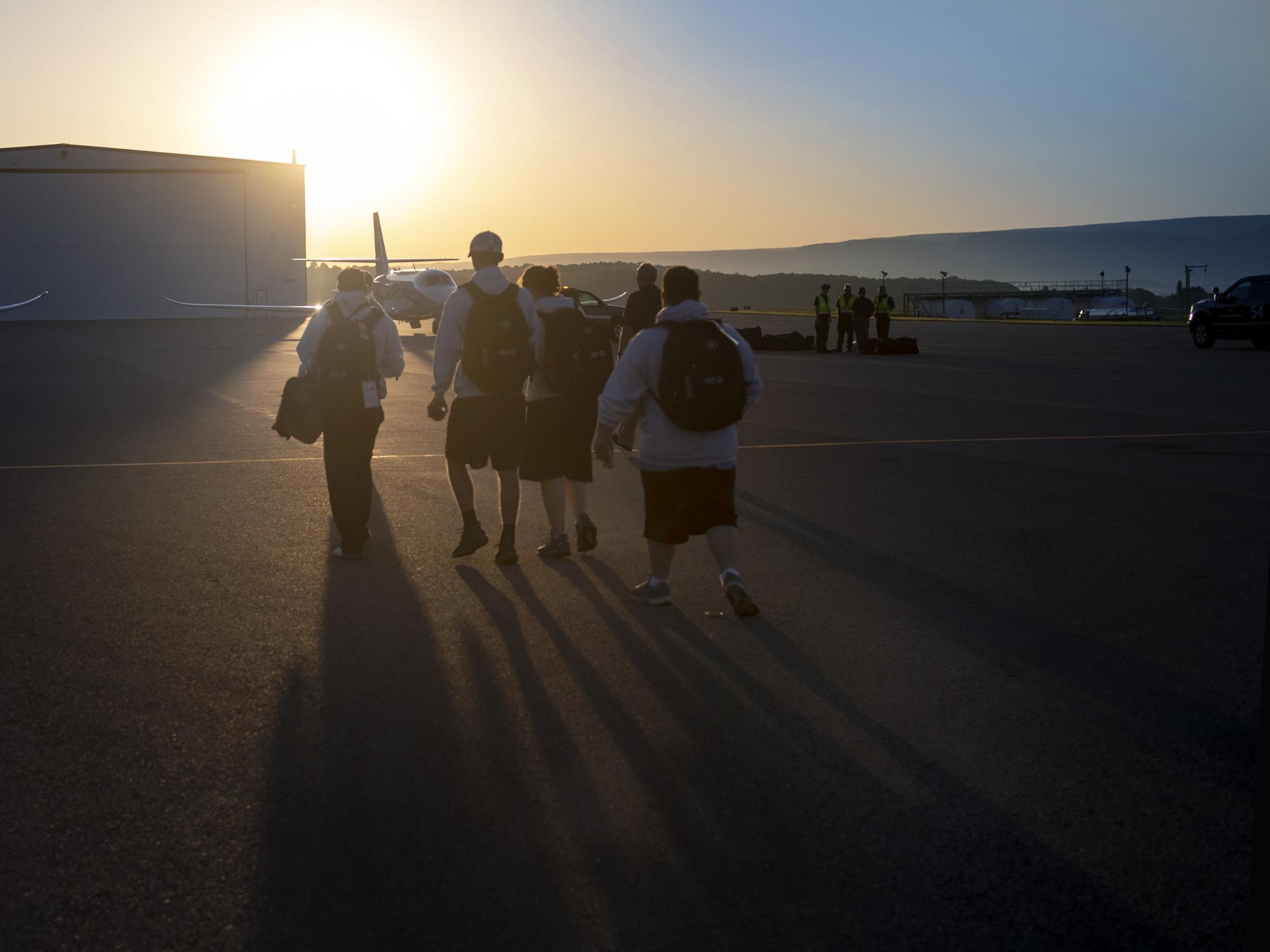 Special Olympians approach their flight