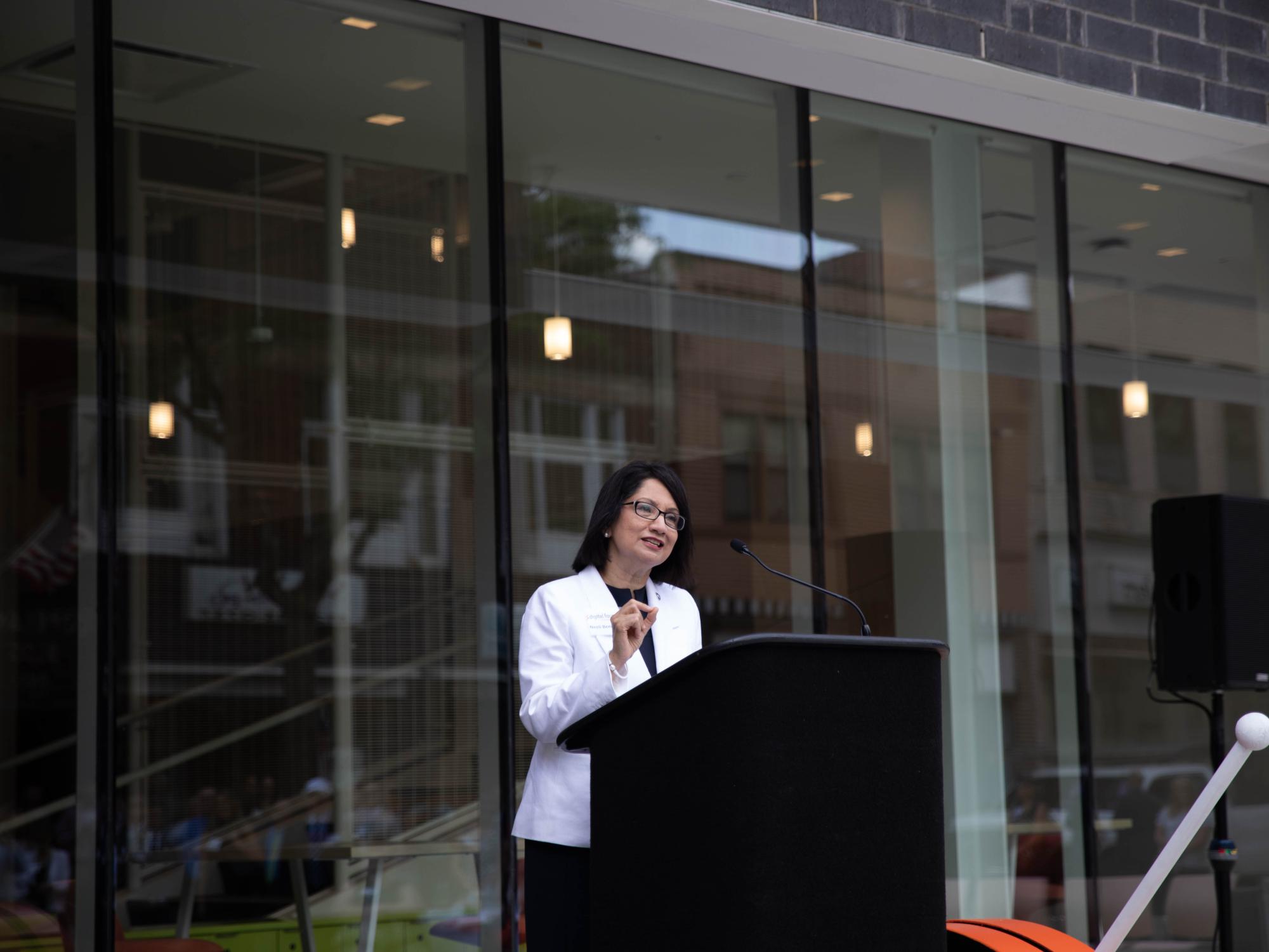 Woman speaks at podium