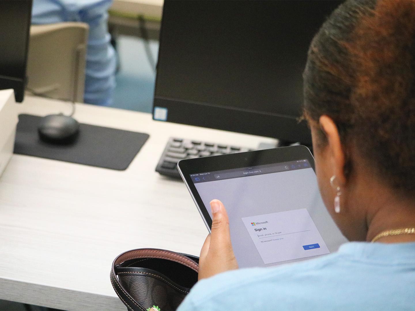 person looking at an iPad screen