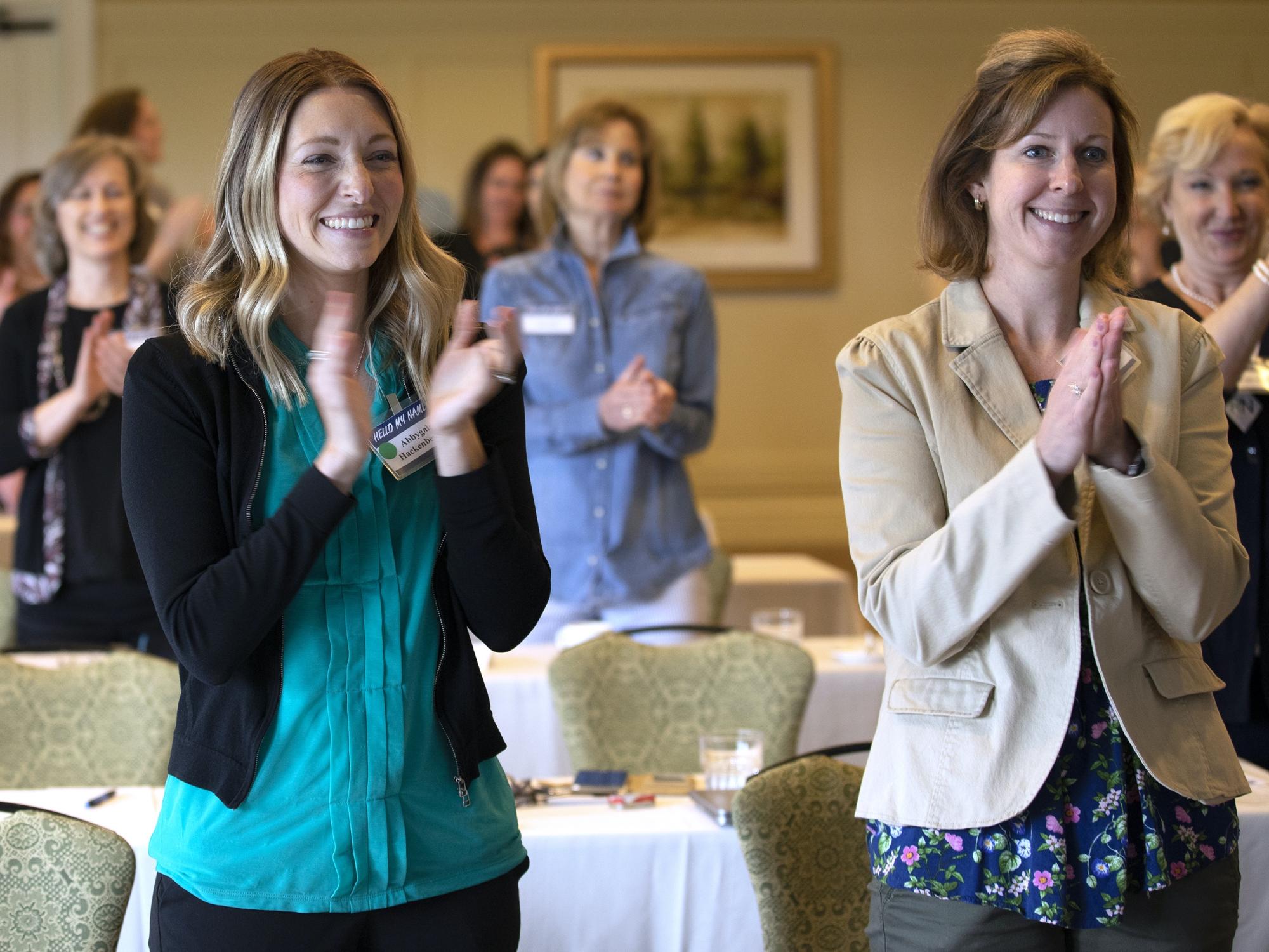 Abbygale Hackenberger and others clapping