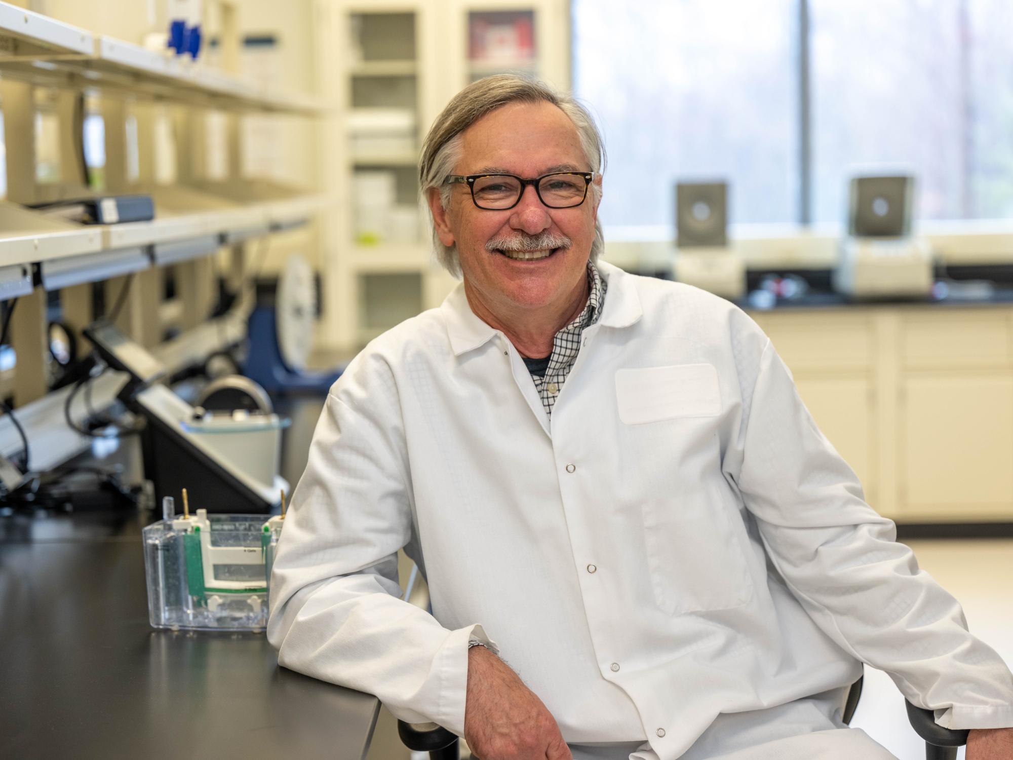 A portrait of Ivor Knight, director of the Biomedical Translational Research Center at Penn State Behrend, in the college's new biomedical research lab.