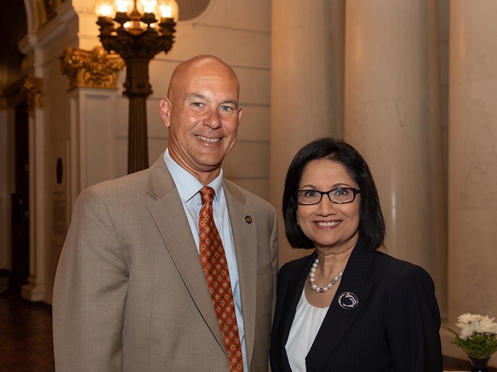 man and women pose for picture in Capitol rotunda