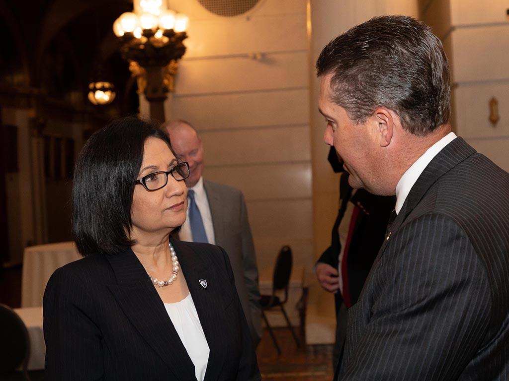 man and woman talking in Capitol Rotunda