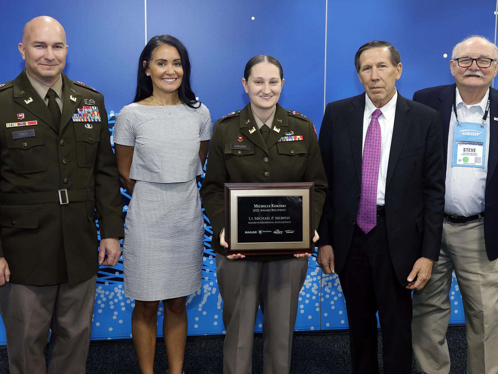Michelle Kokoski receives the Murphy Award with faculty