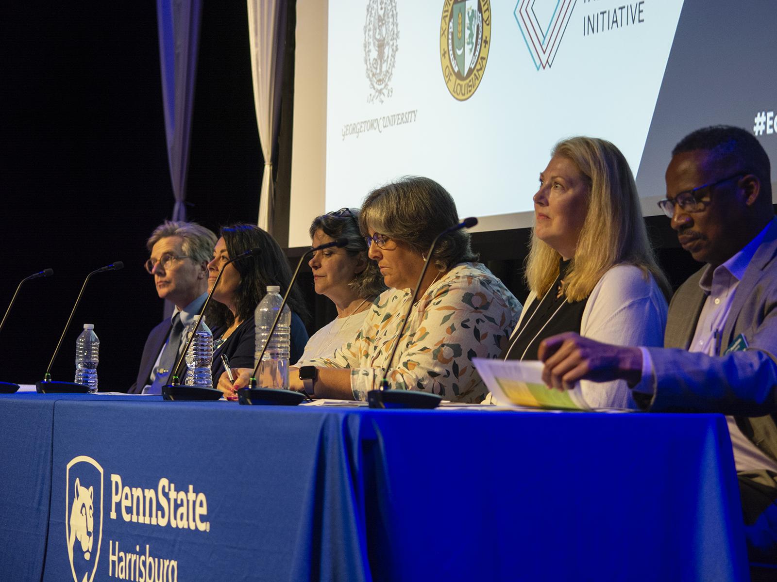 Penn Staters host a workshop panel on a stage at the Penn State Harrisburg campus