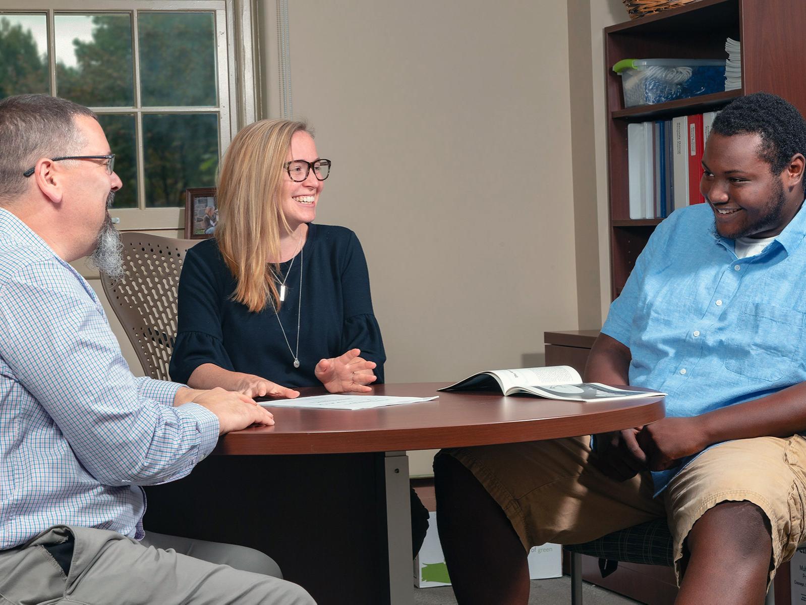 Associate Dean Chris Palma meets with students in Ritenour Building, home to Eberly’s Office for Undergraduate Students, Penn State University Park.