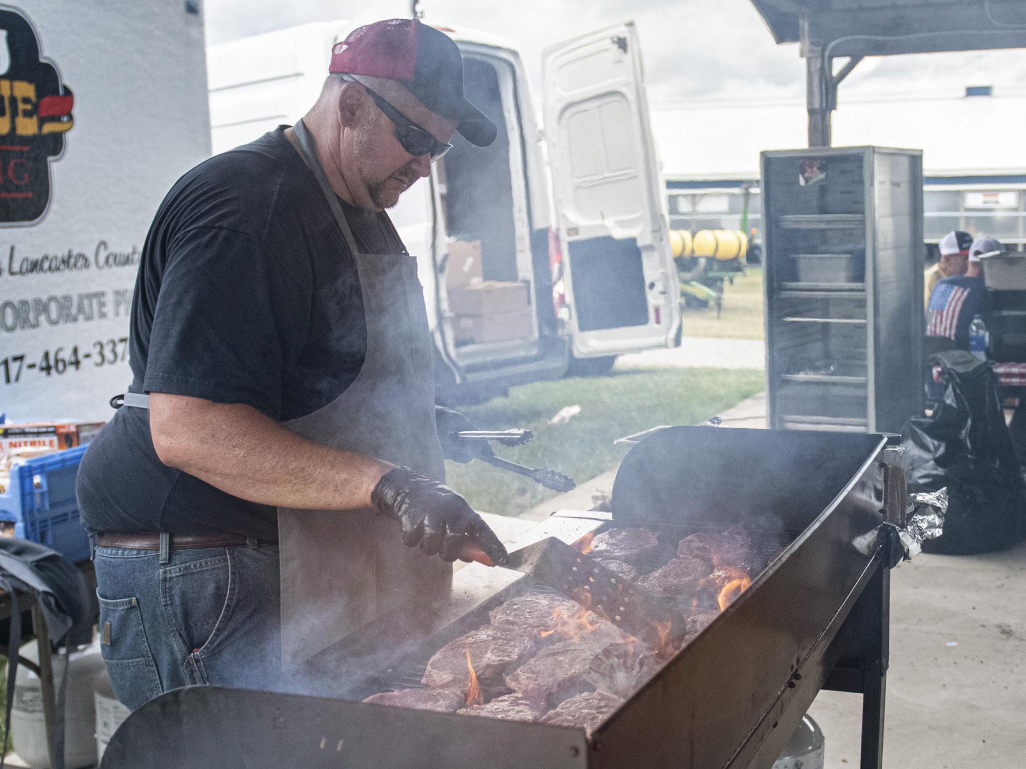 preparing meat for ribeye sandwiches at Ag Progress