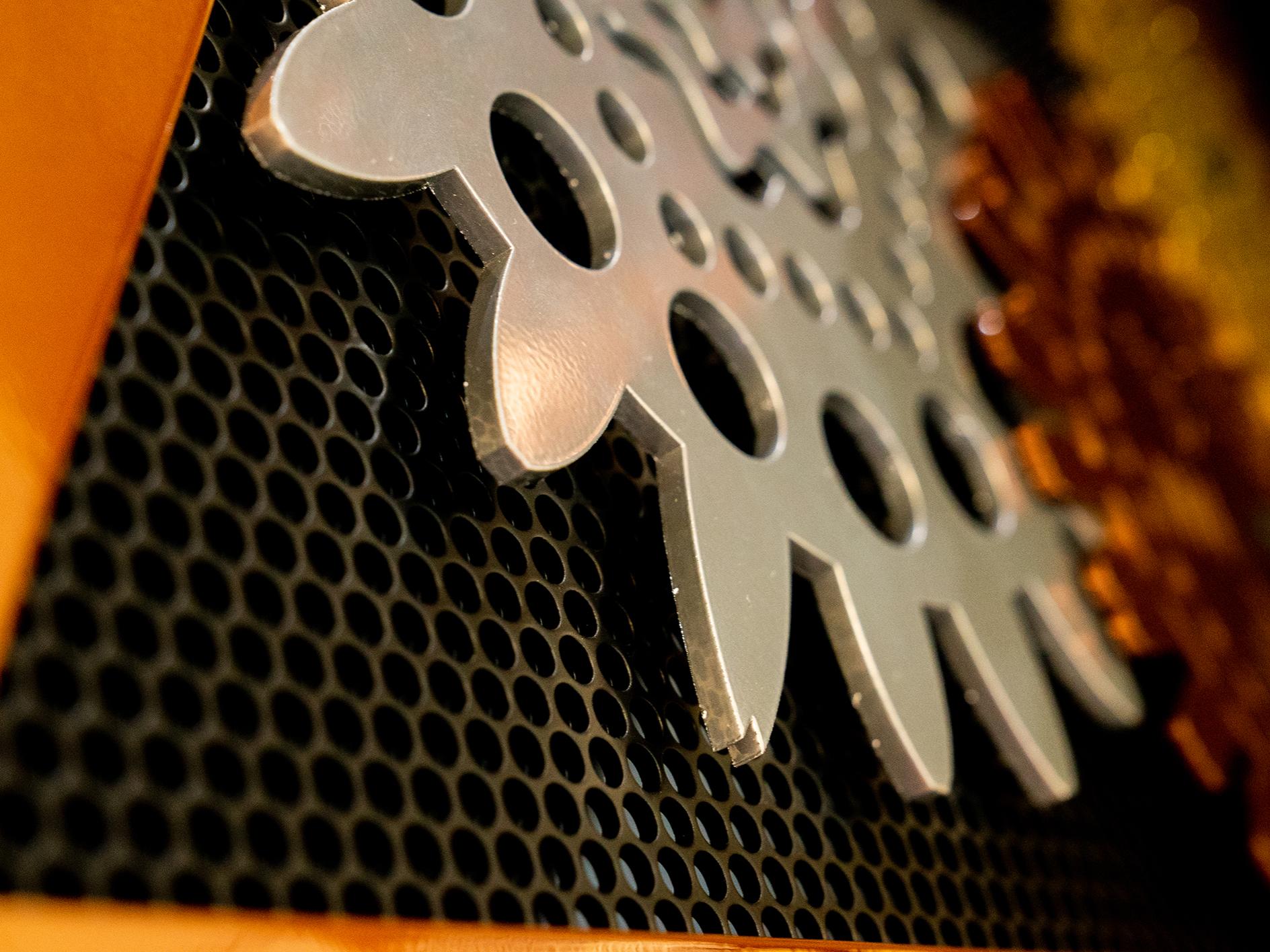 Close-up of a gear and metal mesh of the icosahedron-shaped BioMachine sculpture
