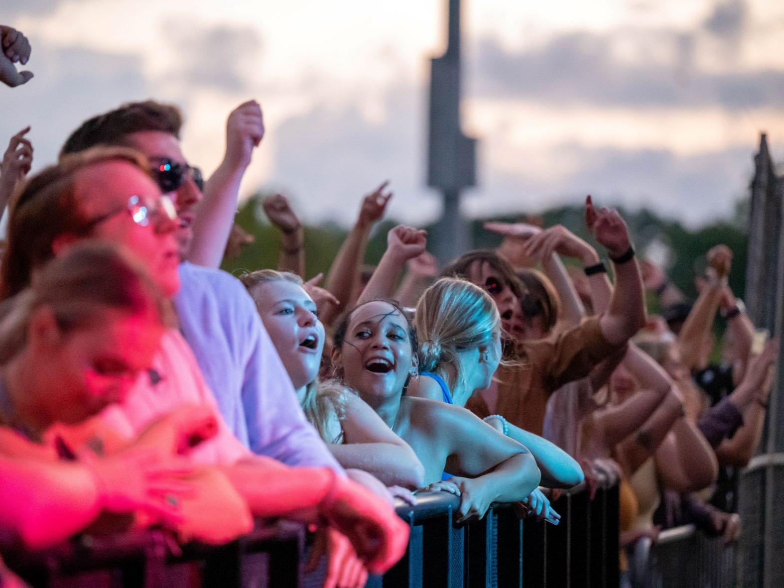 Students in the front row cheer during the Yung Gravy concert at Penn State Behrend.
