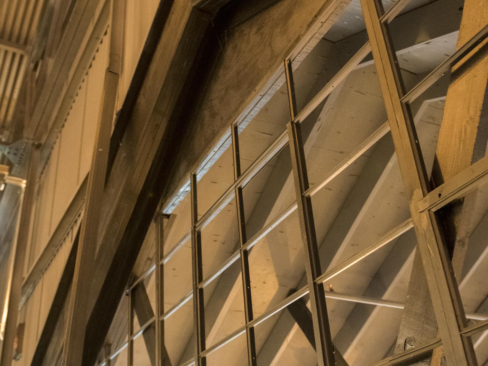 arhitectural details shows arched metal window frames